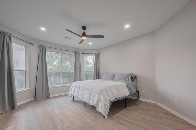 7602 Las Flores Dr, Houston, TX 77083 - bedroom with wood finished floors, a ceiling fan, and recessed lighting
