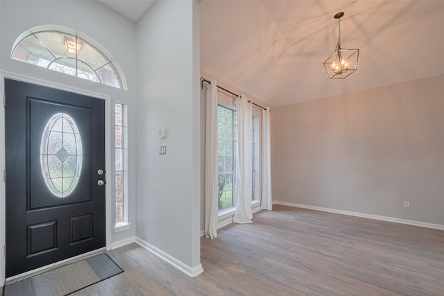 7602 Las Flores Dr, Houston, TX 77083 - foyer featuring a chandelier, wood finished floors, plenty of natural light, and lofted ceiling