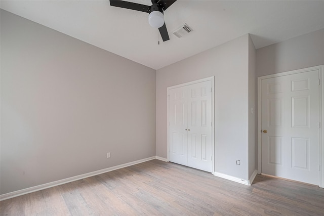 7602 Las Flores Dr, Houston, TX 77083 - unfurnished bedroom featuring wood finished floors, a closet, and ceiling fan