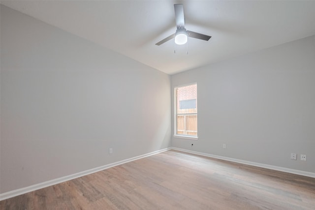 7602 Las Flores Dr, Houston, TX 77083 - empty room with wood finished floors, ceiling fan, and lofted ceiling