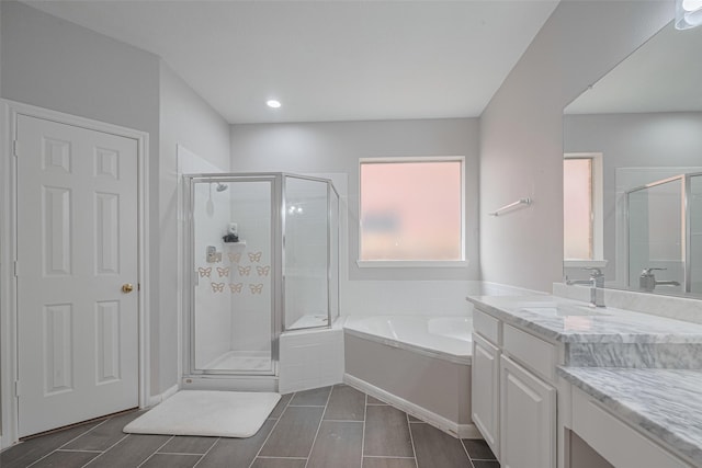 7602 Las Flores Dr, Houston, TX 77083 - bathroom featuring a shower stall, a bath, vanity, and recessed lighting