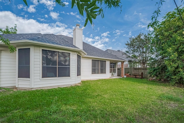7602 Las Flores Dr, Houston, TX 77083 - rear view of property with a chimney and roof with shingles