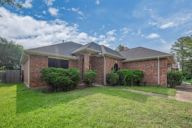 7602 Las Flores Dr, Houston, TX 77083 - view of front facade with a shingled roof and brick siding