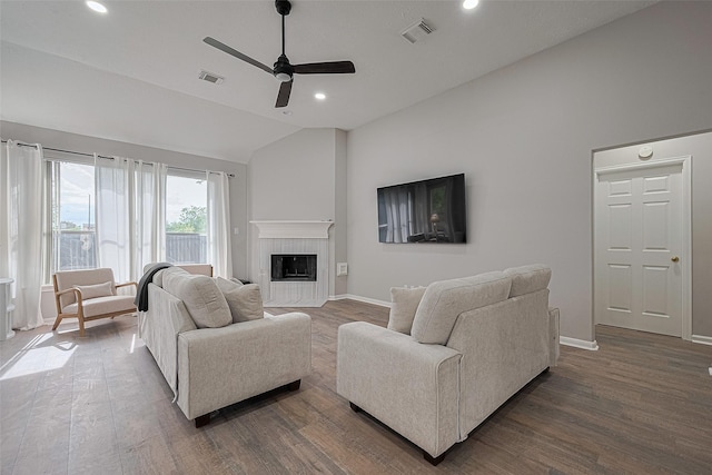 7602 Las Flores Dr, Houston, TX 77083 - living area featuring vaulted ceiling, dark wood-style flooring, ceiling fan, recessed lighting, and a tile fireplace