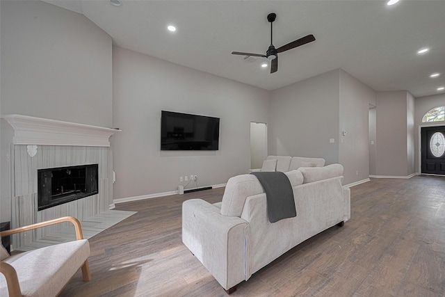 7602 Las Flores Dr, Houston, TX 77083 - living area featuring a ceiling fan, recessed lighting, wood finished floors, and a tiled fireplace