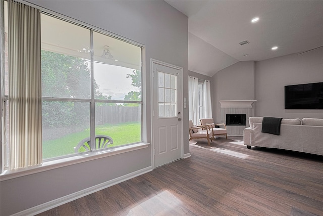 7602 Las Flores Dr, Houston, TX 77083 - entrance foyer with dark wood finished floors, vaulted ceiling, a tile fireplace, and recessed lighting