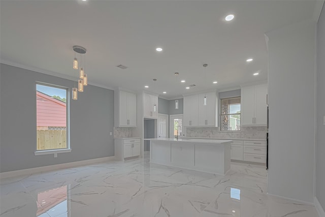 3525 Federal Rd, Pasadena, TX 77504 - kitchen with backsplash, recessed lighting, ornamental molding, white cabinetry, and light marble finish floors
