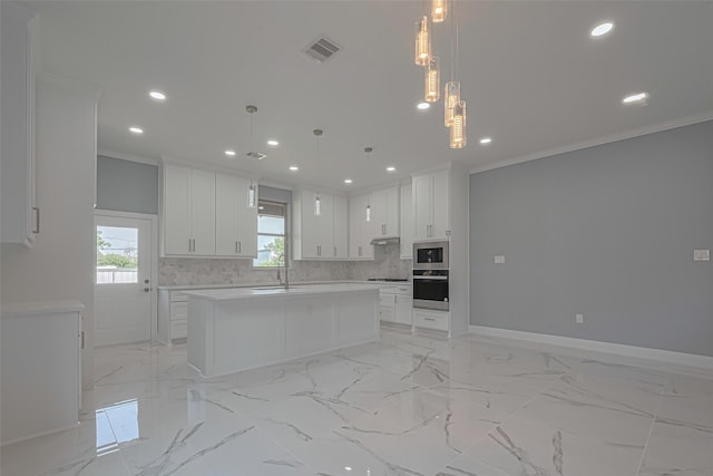 3525 Federal Rd, Pasadena, TX 77504 - kitchen featuring crown molding, appliances with stainless steel finishes, recessed lighting, backsplash, and a center island