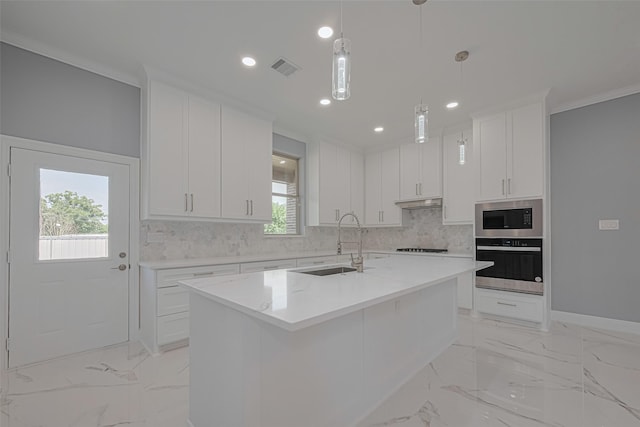 3525 Federal Rd, Pasadena, TX 77504 - kitchen featuring appliances with stainless steel finishes, decorative backsplash, white cabinetry, recessed lighting, and a kitchen island with sink