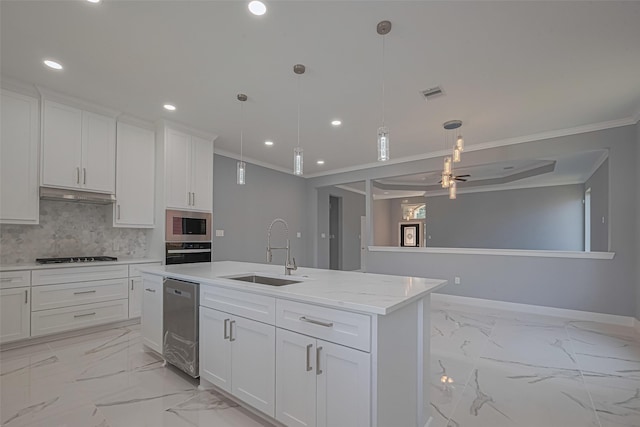 3525 Federal Rd, Pasadena, TX 77504 - kitchen featuring stainless steel appliances, ornamental molding, a center island with sink, recessed lighting, and light marble finish floors