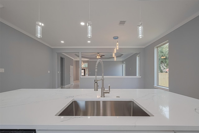 3525 Federal Rd, Pasadena, TX 77504 - kitchen featuring ornamental molding, hanging light fixtures, light stone countertops, open floor plan, and ceiling fan