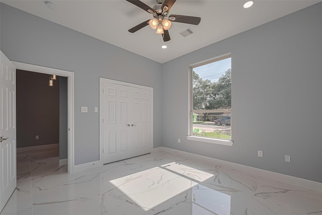 3525 Federal Rd, Pasadena, TX 77504 - unfurnished bedroom featuring light marble finish flooring, recessed lighting, and ceiling fan