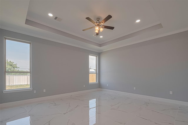 3525 Federal Rd, Pasadena, TX 77504 - empty room with a tray ceiling, a ceiling fan, plenty of natural light, recessed lighting, and ornamental molding