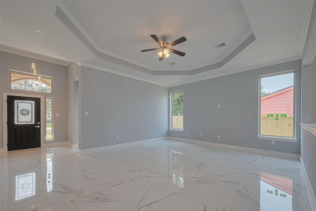 3525 Federal Rd, Pasadena, TX 77504 - foyer featuring a tray ceiling, light marble finish flooring, ceiling fan, and ornamental molding