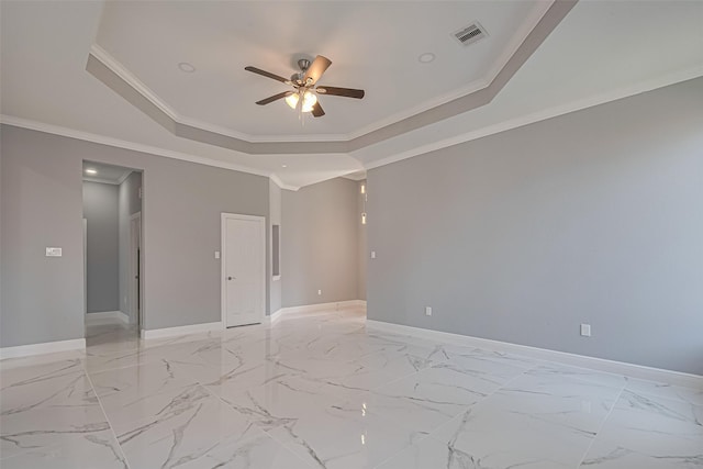 3525 Federal Rd, Pasadena, TX 77504 - spare room featuring a tray ceiling, ceiling fan, crown molding, and light marble finish flooring