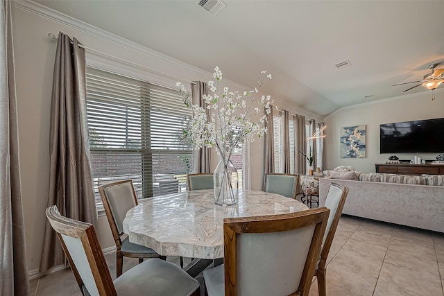 2226 Blakely Grove Ln, Richmond, TX 77469 - dining room with vaulted ceiling, plenty of natural light, light tile patterned floors, ceiling fan, and ornamental molding