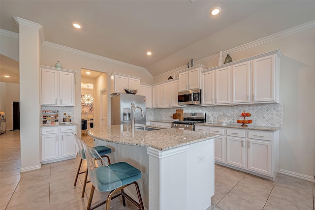 2226 Blakely Grove Ln, Richmond, TX 77469 - kitchen with stainless steel appliances, light tile patterned floors, backsplash, white cabinets, and ornamental molding