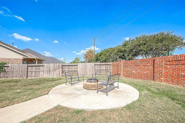2226 Blakely Grove Ln, Richmond, TX 77469 - fenced backyard featuring a fire pit and a patio area