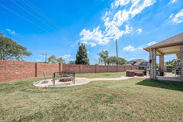 2226 Blakely Grove Ln, Richmond, TX 77469 - fenced backyard featuring an outdoor living space with a fire pit and a patio area