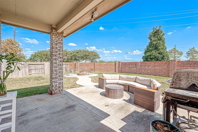 2226 Blakely Grove Ln, Richmond, TX 77469 - fenced backyard featuring a patio and an outdoor living space with a fire pit