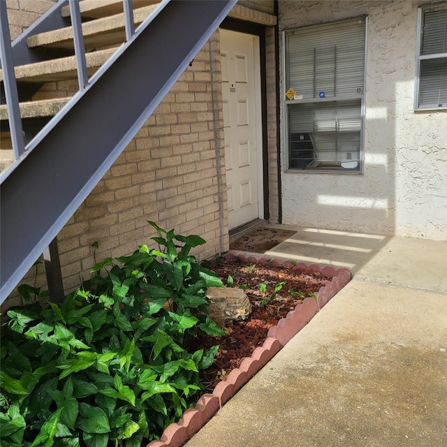 2021 Spenwick Dr Unit 513, Houston, TX 77055 - view of exterior entry with brick siding