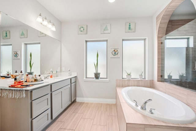 19822 Blue Roan Dr, Tomball, TX 77377 - full bathroom featuring double vanity and a bath
