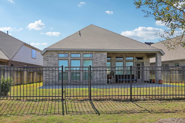 19822 Blue Roan Dr, Tomball, TX 77377 - rear view of house with brick siding and roof with shingles