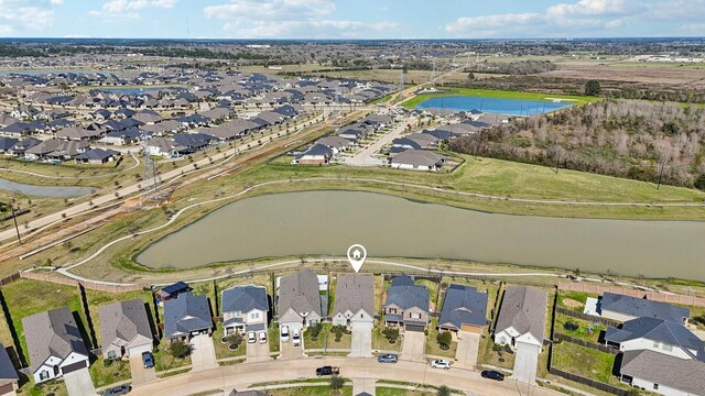 19822 Blue Roan Dr, Tomball, TX 77377 - view of property location with a large body of water and nearby suburban area