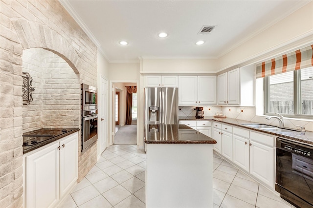 11410 Del Monte Dr, Houston, TX 77077 - kitchen with black appliances, ornamental molding, dark stone counters, a kitchen island, and backsplash