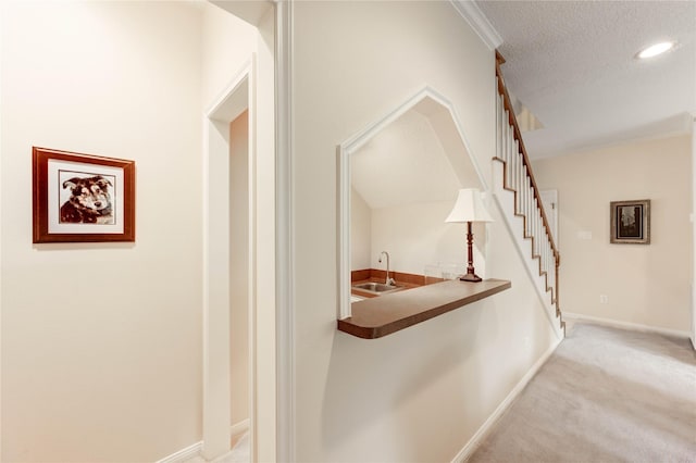 11410 Del Monte Dr, Houston, TX 77077 - corridor with carpet flooring, a textured ceiling, stairway, and recessed lighting