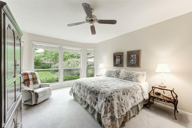 11410 Del Monte Dr, Houston, TX 77077 - carpeted bedroom featuring multiple windows and a ceiling fan