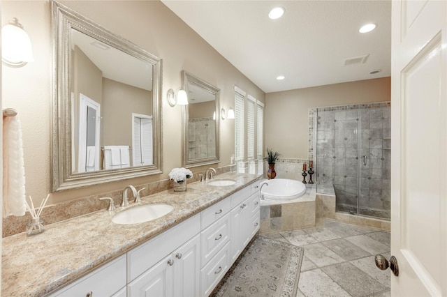 11410 Del Monte Dr, Houston, TX 77077 - bathroom with a garden tub, double vanity, a shower stall, and recessed lighting