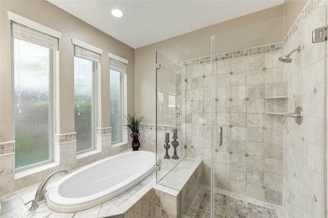 11410 Del Monte Dr, Houston, TX 77077 - full bathroom with a bath, a shower stall, and recessed lighting