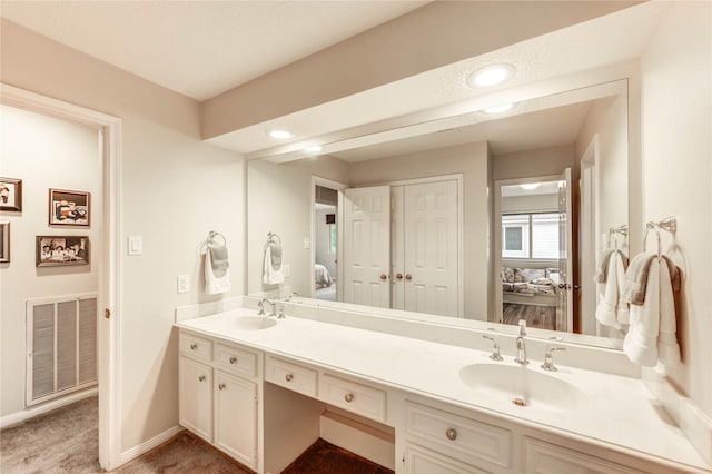 11410 Del Monte Dr, Houston, TX 77077 - full bath featuring double vanity, ensuite bath, and recessed lighting