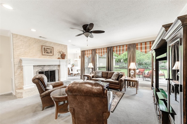 11410 Del Monte Dr, Houston, TX 77077 - living room with light colored carpet, ornamental molding, a ceiling fan, a brick fireplace, and a textured ceiling