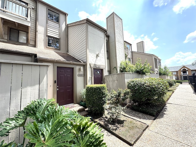 1083 Country Place Dr Unit 28, Houston, TX 77079 - doorway to property with stucco siding and a chimney