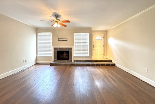 1083 Country Place Dr Unit 28, Houston, TX 77079 - unfurnished living room with a ceiling fan, dark wood-type flooring, a tile fireplace, and ornamental molding