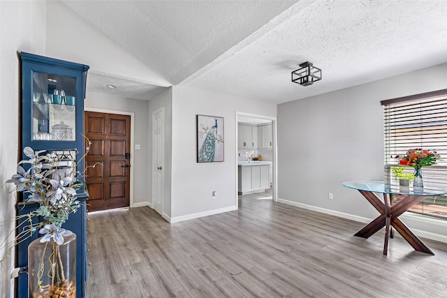 2806 Spring Dusk Ln, Spring, TX 77373 - entrance foyer with wood finished floors and a textured ceiling