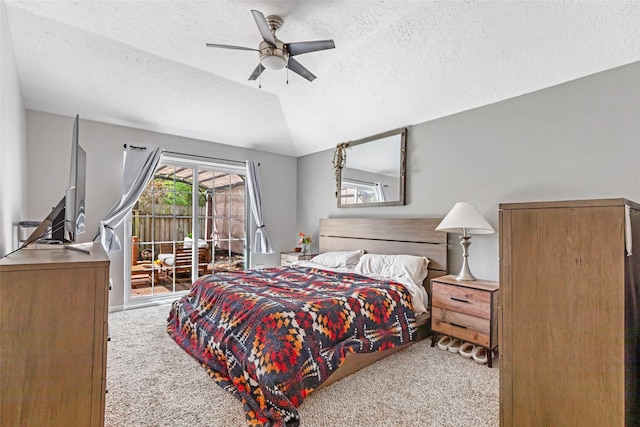 2806 Spring Dusk Ln, Spring, TX 77373 - carpeted bedroom featuring access to outside, vaulted ceiling, a textured ceiling, and a ceiling fan