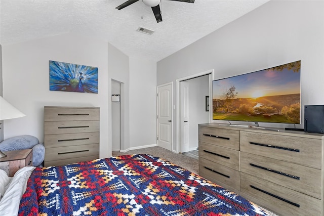 2806 Spring Dusk Ln, Spring, TX 77373 - carpeted bedroom with a textured ceiling, vaulted ceiling, and a ceiling fan