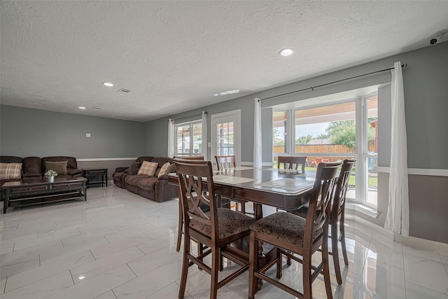 12206 Green Glade Dr, Houston, TX 77099 - dining area featuring a textured ceiling and recessed lighting
