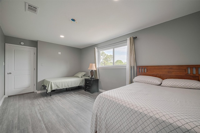 12206 Green Glade Dr, Houston, TX 77099 - bedroom with light wood finished floors and recessed lighting