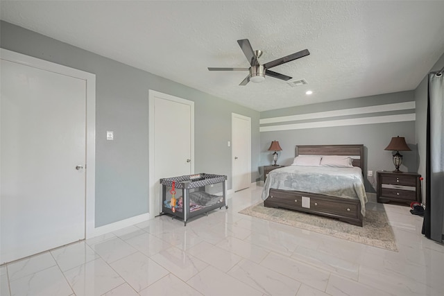 12206 Green Glade Dr, Houston, TX 77099 - bedroom with marble look tiles, a textured ceiling, and ceiling fan