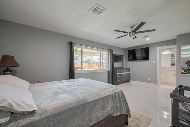 12206 Green Glade Dr, Houston, TX 77099 - bedroom with light marble finish flooring, a textured ceiling, ensuite bath, and a ceiling fan