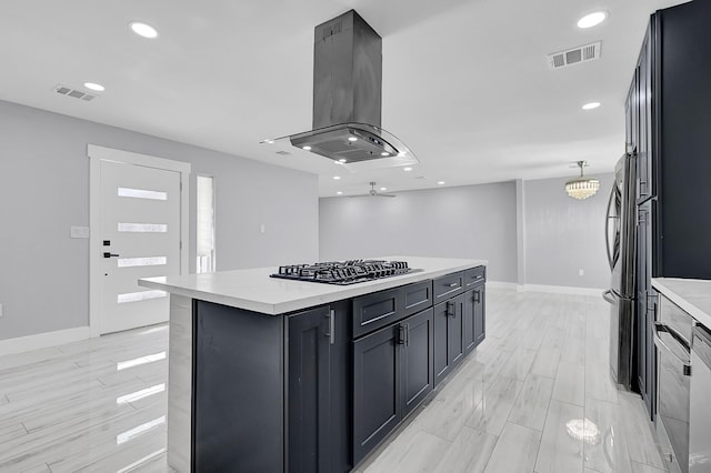 4927 Kelso St, Houston, TX 77021 - kitchen with stainless steel gas cooktop, island range hood, light countertops, a kitchen island, and recessed lighting