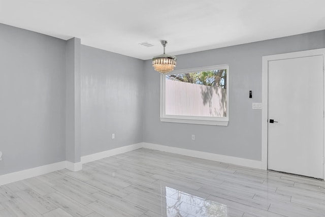 4927 Kelso St, Houston, TX 77021 - unfurnished room with a chandelier and light wood finished floors