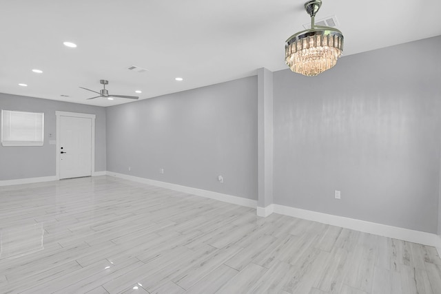 4927 Kelso St, Houston, TX 77021 - spare room featuring a chandelier, recessed lighting, light wood-style flooring, and ceiling fan