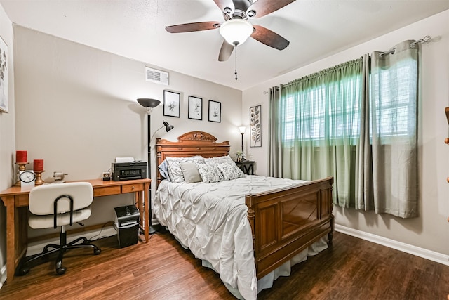114 Wyndwood Dr, Seabrook, TX 77586 - bedroom with dark wood-style floors, an office area, and a ceiling fan