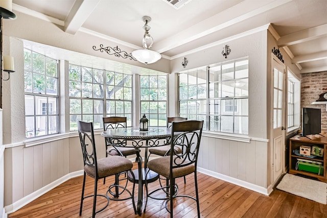114 Wyndwood Dr, Seabrook, TX 77586 - dining space featuring hardwood / wood-style floors, plenty of natural light, beam ceiling, and wainscoting