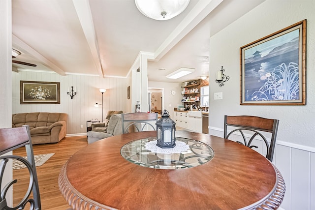 114 Wyndwood Dr, Seabrook, TX 77586 - dining room with beamed ceiling, light wood finished floors, crown molding, and a decorative wall